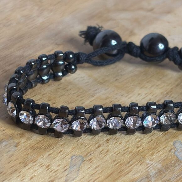 Black corded bracelet with white silver tone rhinestones with beaded closure - Picture 1 of 6
